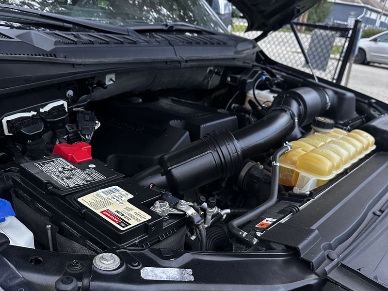 Ford truck engine bay after a full engine bay clean in Calgary