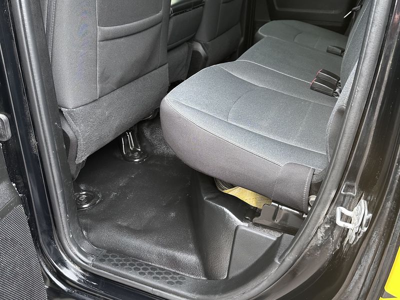 Work truck rear bench and floor after interior detailing in Calgary